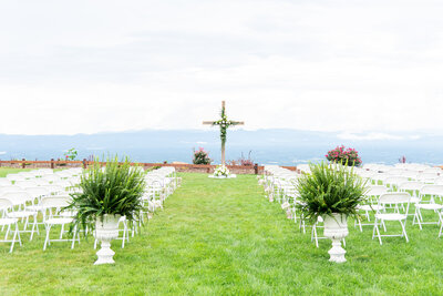 A wedding ceremony set up at Hidden Hill wedding venue. A beautiful view of the Blue Ridge Mountains are behind.
