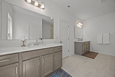 Primary ensuite dual vanity bathroom, with semi frameless walking shower and soaker tub