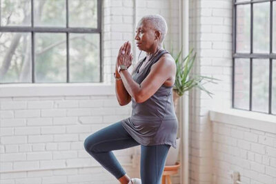 older woman doing yoga