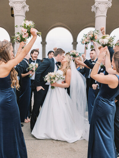 Bride and groom nose to nose with closed mouth smiles