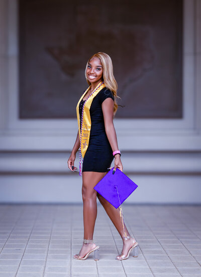 a high school graduate holding her cap