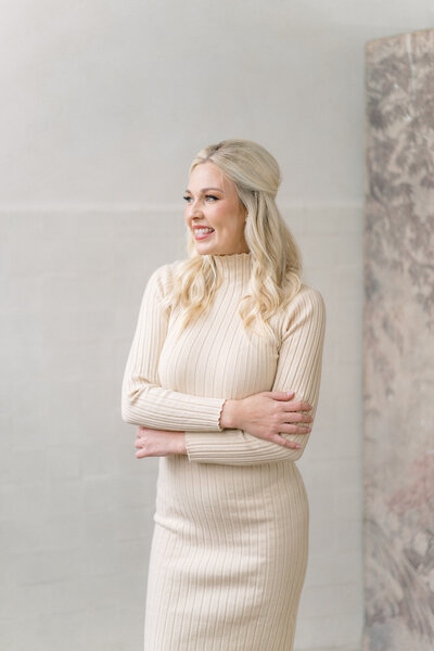 Natasha Kozlowski, luxury wedding planner in Austin and New Orleans, wearing cream dress