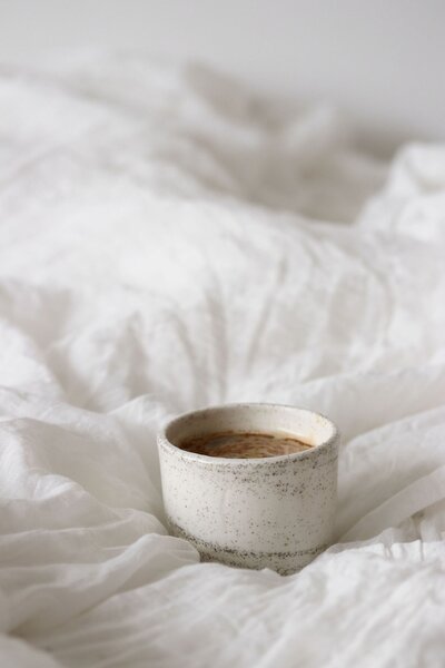 Coffee Cup on Bed