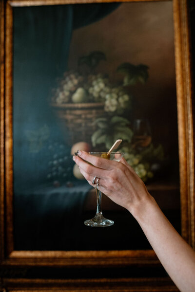 Close-up detail shot of a bride holding a champagne glass on her wedding day, captured by NYC wedding and elopement photographer Dom Augustine.