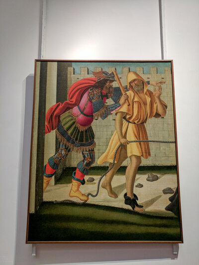 FIgures on the Road to Calvary by Sandro Botticelli hanging in the Uffizi Gallery in Florence, Italy.