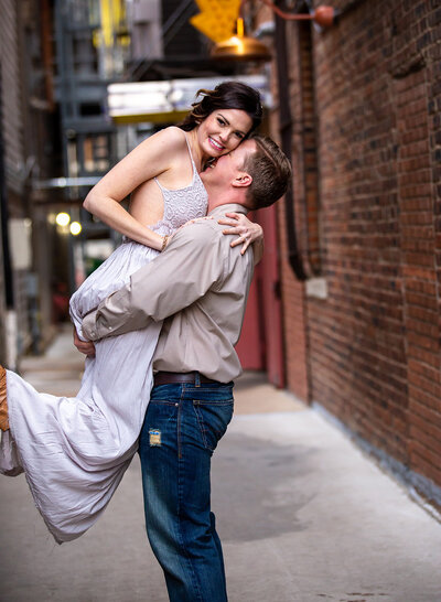 guy sweeping happy woman off her feet