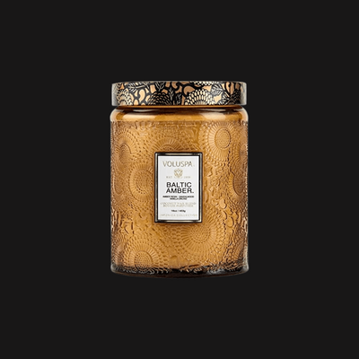 Product image of  Voluspa Baltic Amber Candle with black background