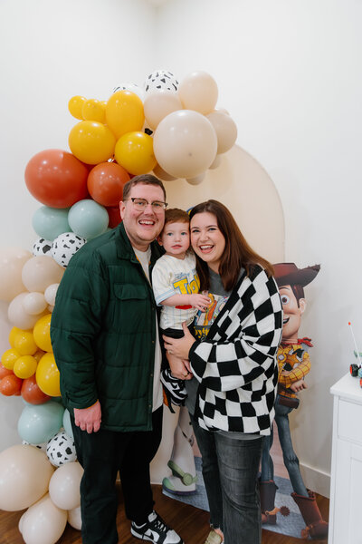 fun family photo at son's birthday