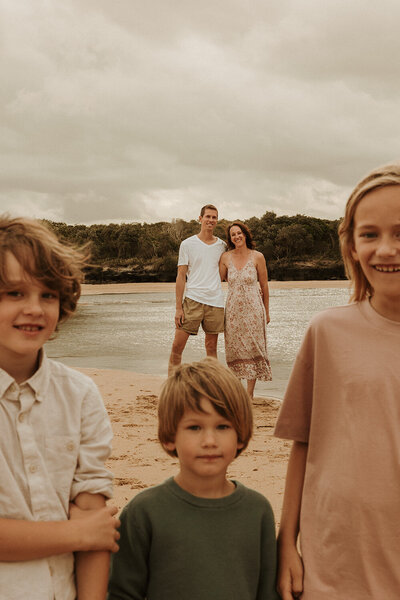 Sunshine Coast photographer capturing a relaxed, natural family portrait on the beach.