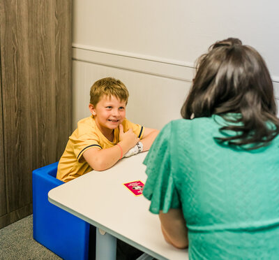 child in speech therapy session in Elk Grove CA focused on communication and literacy