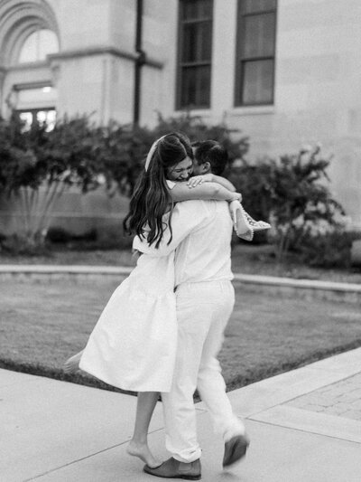 Black and white photo of couple hugging each other