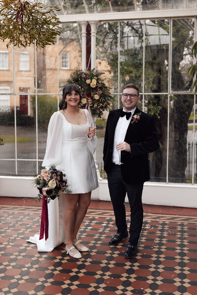 Wedding photographer captures couple taking a stroll hand in hand at their french chateau wedding.