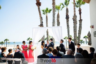 Bride and Groom exchange vows on a beach ceremony