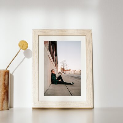 Springfielframed photo of teenage boy in downtown Springfield MO during senior photography session