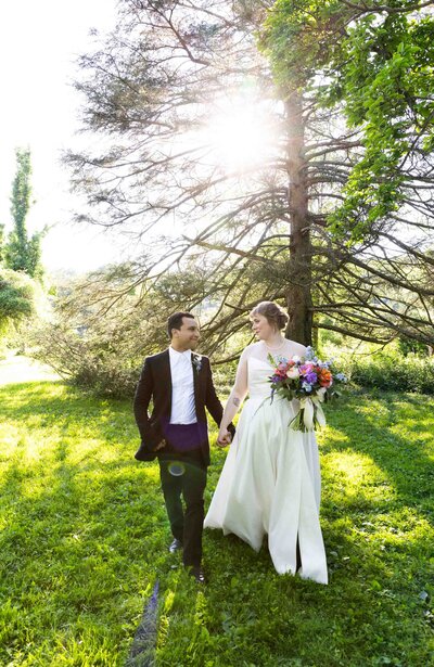 Bride and Groom Holding Hands, Wedding Portrait, backlit at Tyler Arboretum,  Media PA 