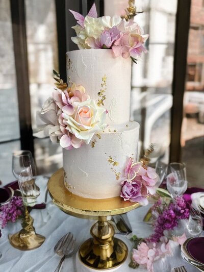 Two tier Butterfly Garden cake by Artisan Buttercream.