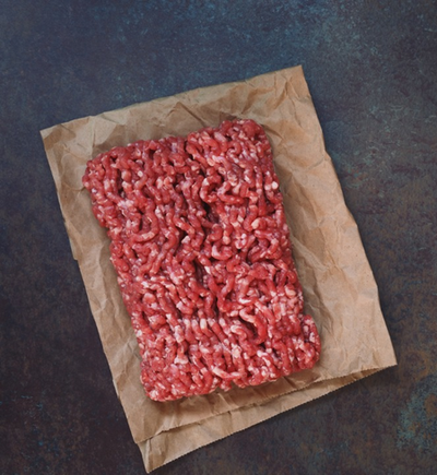 Ground beef wrapped in brown paper
