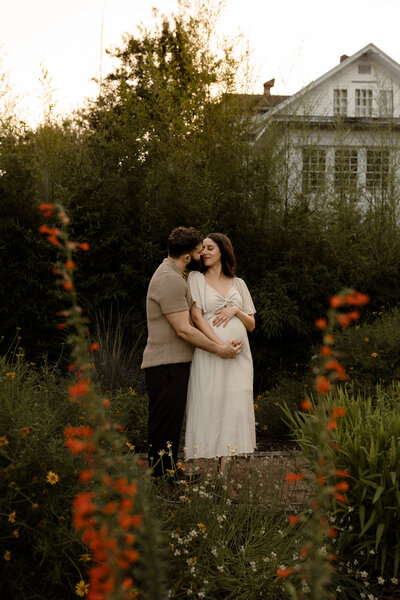 Pregnant woman and husband posing together