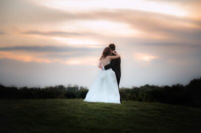 Couple watches the sunset at Colonial Heritage golf course Photographed by Kristen Vann