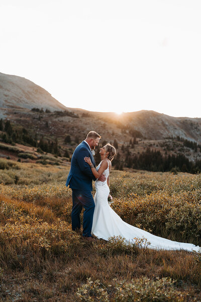 Wedding Photos of a couple with golden light at the Barn At Sunset Ranch in Buena Vista Colorado