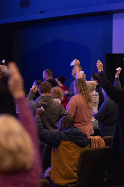 A multicultural group of people worshiping together at a non-denominational church in Fayetteville, NC. 