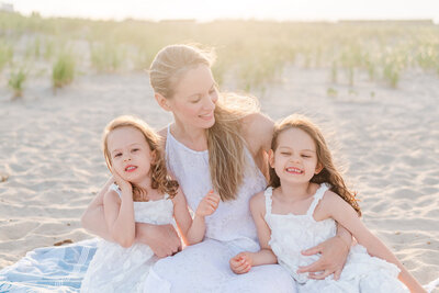 Mom and daughters on beach