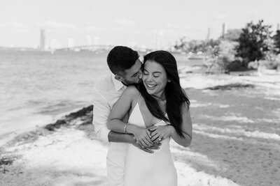 newlyweds laughing laying on bed