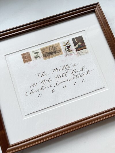 Framed  envelope with calligraphy and vintage postage stamps