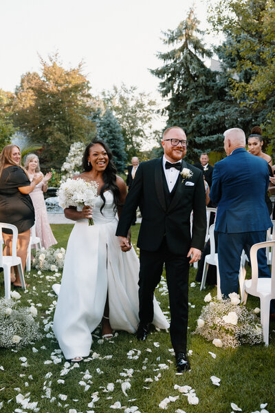 wedding couple walking down aisle