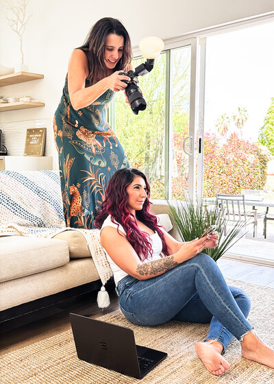 Brand photographer shooting from above, using the couch to get the best angle