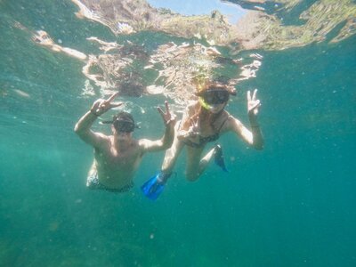 couple swimming in ocean