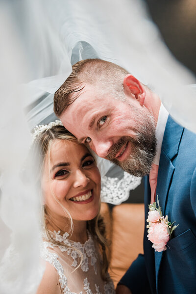 Close up of newlyweds underneath the bride's veil during an intimate small wedding in Tacoma Washington
