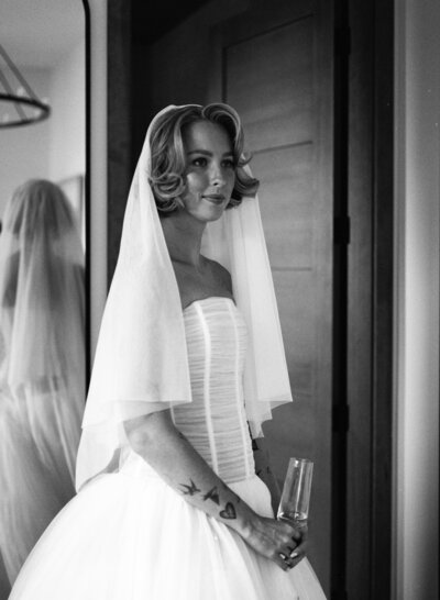 Minimalistic wedding tablescape with glassware and wine bottles