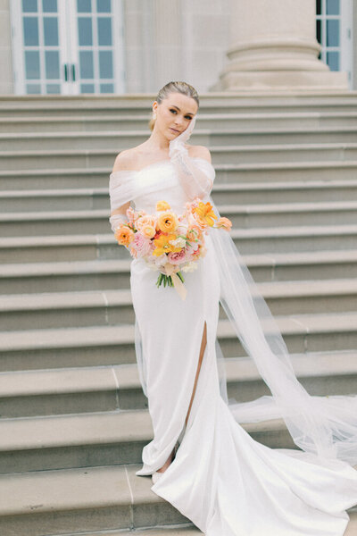 bride with flowers looking at the camera