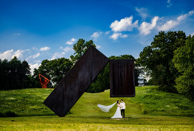 Artistic Storm King Art Center wedding photography. Your love is set against breathtaking sculptures.