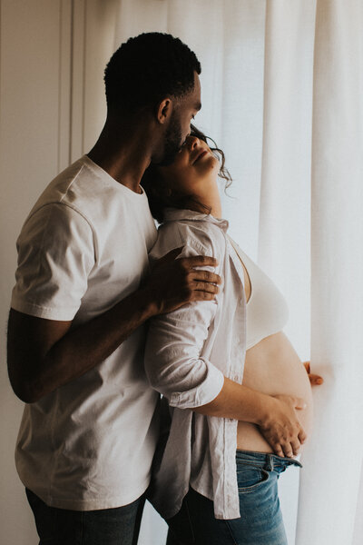 A tender maternity moment captured by T & M Photo (TM Photography), showing a couple’s intimate embrace in Sacramento CA. Perfect for those seeking lifestyle photography, in the moment photography, and boudoir photographer near me.
