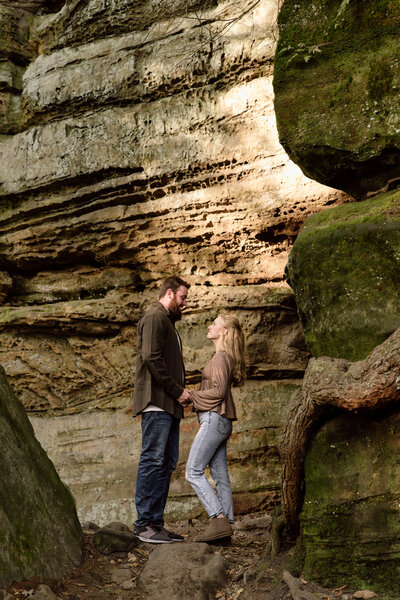 Couple standing in Kendall Ledges among the rocks.