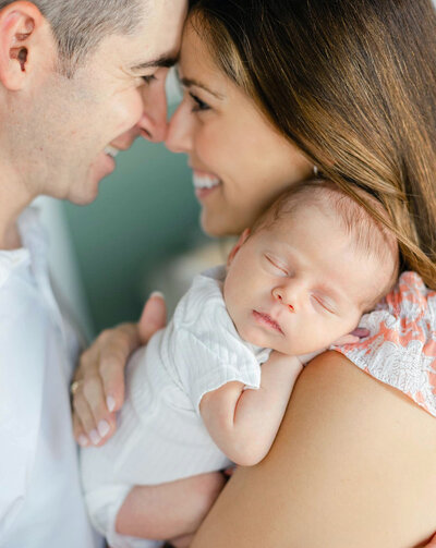 newborn posed with parents