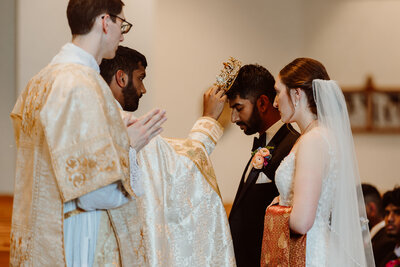 Bride and groom during their crowning ceremony