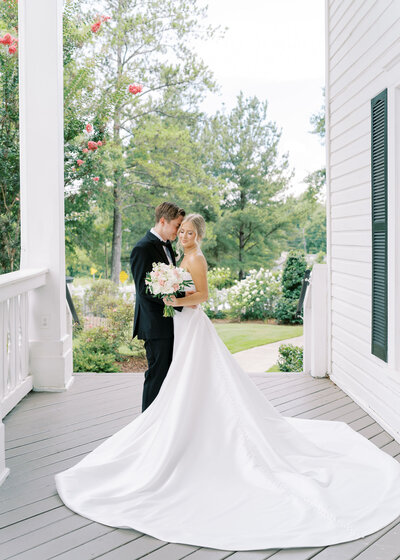 bride and groom holding hands