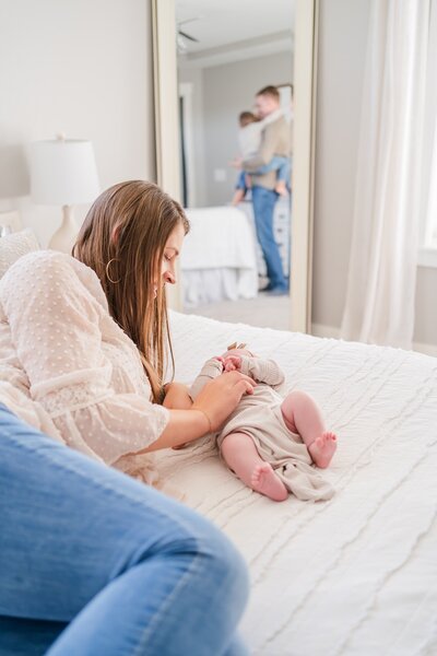 eau claire in home newborn session mom and baby