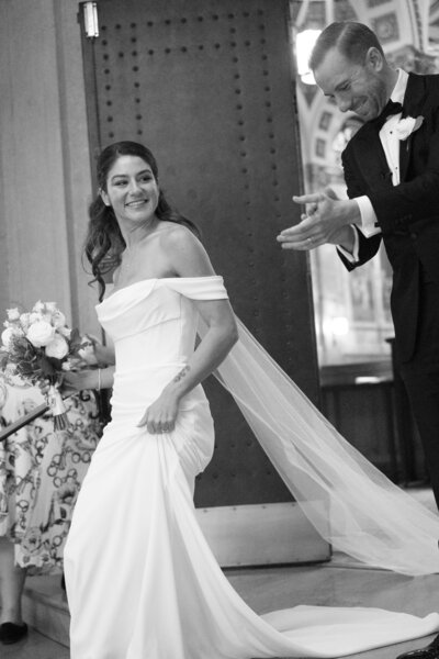 bride and groom exit St. Ignatius Loyola Church in New York City after wedding ceremony