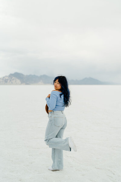 Headshot of Arianna Maddox Photography a California Wedding photographer full body headshot at bonneville salt flats in Utah