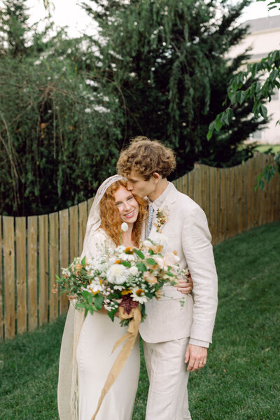 Editorial-style wedding portrait of the bride and groom in an intimate backyard setting in Richmond.