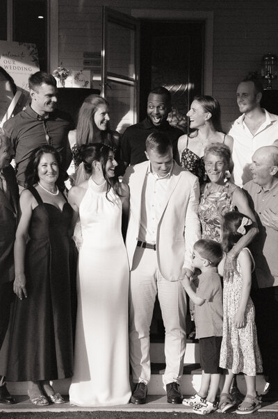 Newlywed couple kissing holding their cats