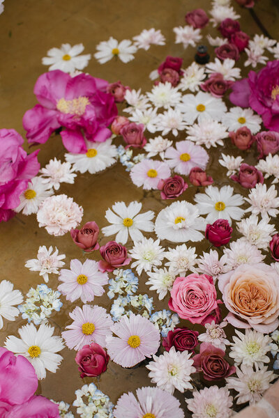 Pink flowers in a water fountain