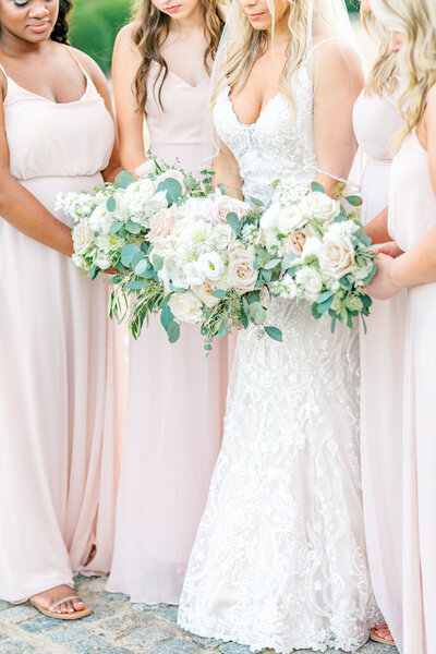 Atlanta Wedding Photographer | Bridesmaids In Pale Pink Dresses With The Bride Bringing White And Pink Florals