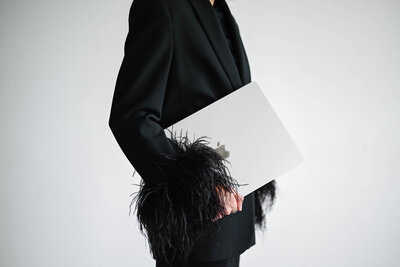 woman sitting on a stool and smiling