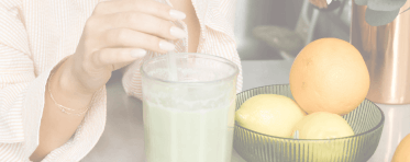 Woman drinking a matcha in her kitchen