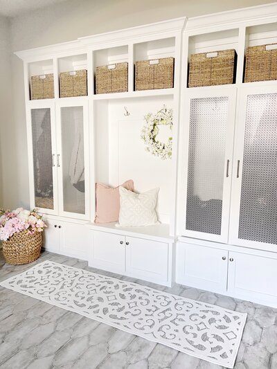 Entryway featuring built in cabinets and decorated with MTH pillows